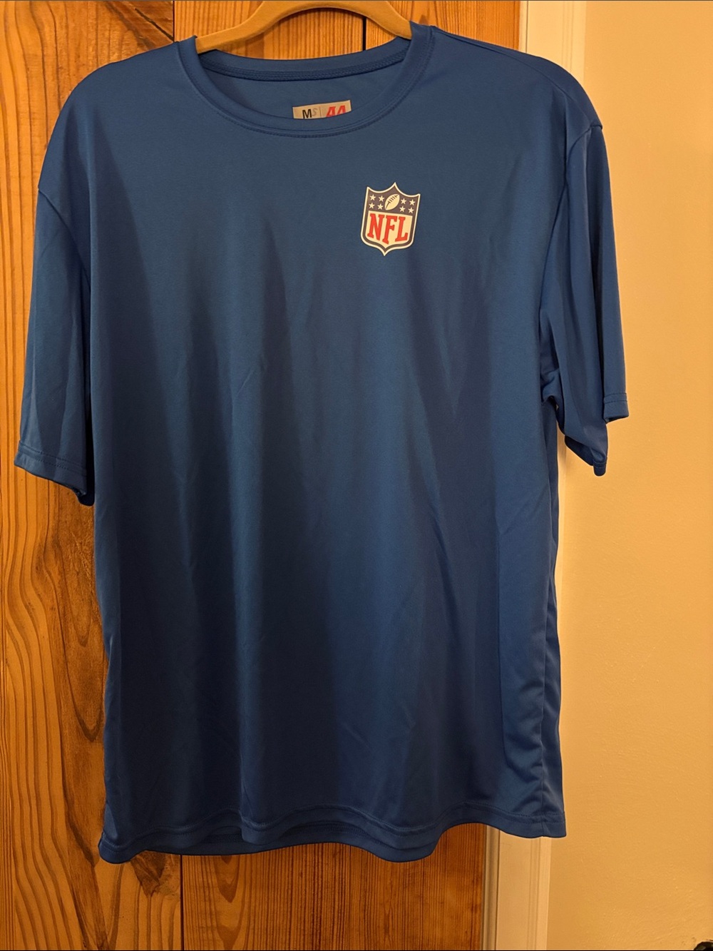 NFL Blue Short Sleeve Performance Tee with Shield Logo